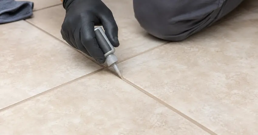 grout color sealing service being applied to floor tile in Weston Shops, Winnipeg